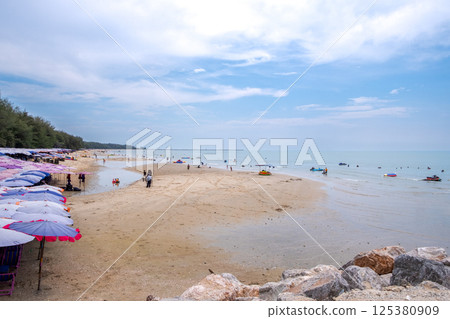 Cha-am Beach with Blue Sky and Calm Sea Cha-am Beach with Blue Sky and Calm Sea 125380909