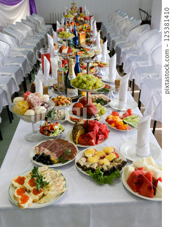Wedding table with a variety of food. Wedding table with a variety of food. 125381410