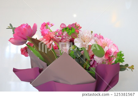 Bouquet of pink flowers and purple flowers Bouquet of pink flowers and purple flowers 125381567