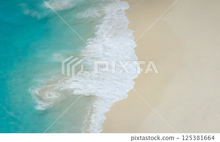 Aerial View of Waves on Sandy Beach 125381664