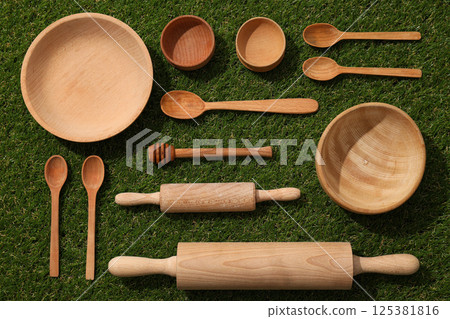 Reusable tableware made of wood on grass. 125381816