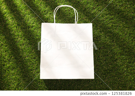 Eco bag, reusable, for shopping, on grass. Eco bag, reusable, for shopping, on grass. 125381826