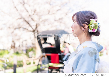 A middle-aged woman in a kimono sightseeing in Koedo in spring A middle-aged woman in a kimono sightseeing in Koedo in spring 125381866