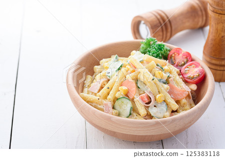 Macaroni salad served in a wooden bowl Macaroni salad served in a wooden bowl 125383118