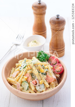 Macaroni salad served in a wooden bowl Macaroni salad served in a wooden bowl 125383134
