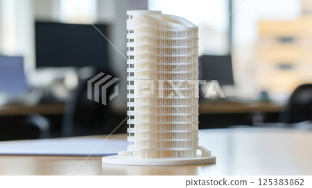 Modern architectural building model in office setting Modern architectural building model in office setting 125383862