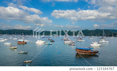 April 21 2025 Scenic Harbor View With Boats Anchored Under a Vibrant Sky April 21 2025 Scenic Harbor View With Boats Anchored Under a Vibrant Sky 125384767