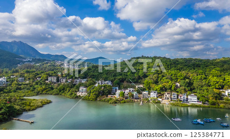 April 21 2025 Scenic Lakeside Homes Surrounded by Lush Green Hills 125384771