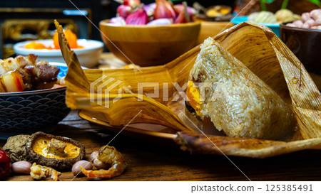Zongzi, opened, zong leaves, glutinous rice, fillings, Taiwan, China Zongzi, opened, zong leaves, glutinous rice, fillings, Taiwan, China 125385491