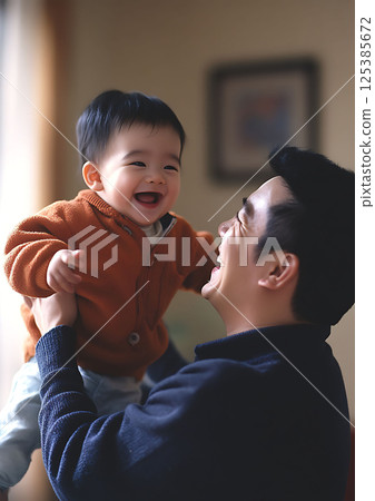 father lifting child in living room, joyful expression, bonding moment father lifting child in living room, joyful expression, bonding moment 125385672