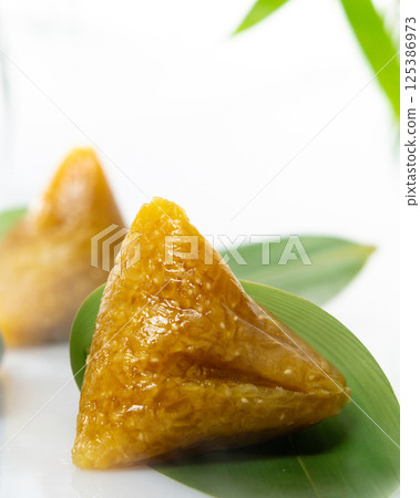 alkali rice dumpling, china, dragon boat festival, bamboo leaves, glutinous rice alkali rice dumpling, china, dragon boat festival, bamboo leaves, glutinous rice 125386973