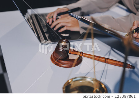 Concept of legal counseling. The lawyer or legal counsel is listening and providing advice to business people. Concept of legal counseling. The lawyer or legal counsel is listening and providing advice to business people. 125387861