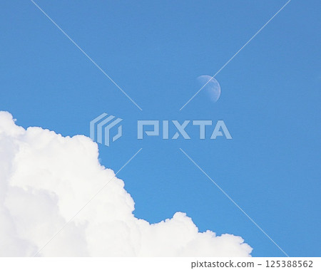 Blue sky, clouds and half moon 125388562
