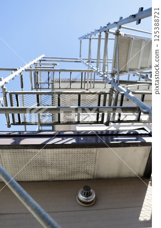 Construction site of an old detached house with wedge scaffolding Construction site of an old detached house with wedge scaffolding 125388721