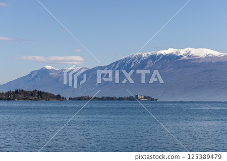 Lake Garda in Italy on a sunny spring morning with a view of Isola del Garda 125389479