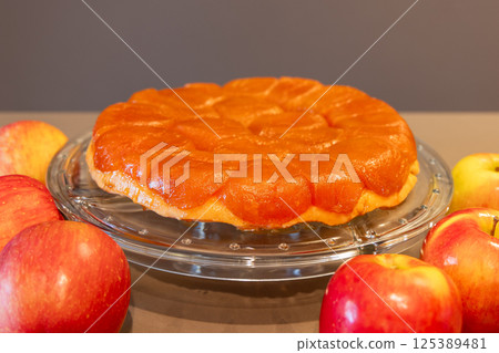 Homemade apple Tarte Tatin with shiny fruit topping and buttery crust 125389481