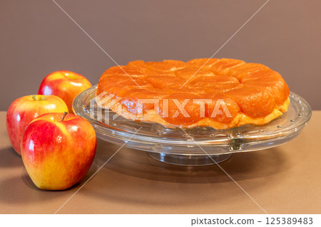 Perfectly baked homemade Tarte Tatin with glossy caramelized apple topping and golden crust Perfectly baked homemade Tarte Tatin with glossy caramelized apple topping and golden crust 125389483