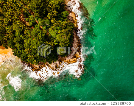 Top view seashore waves nature background,Amazing waves crashing on rocks seascape view 125389700