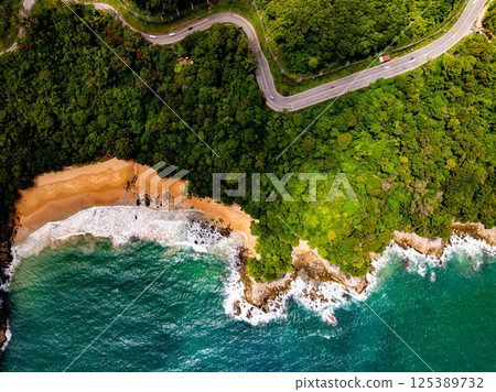 Top view seashore waves nature background,Amazing waves crashing on rocks seascape view 125389732