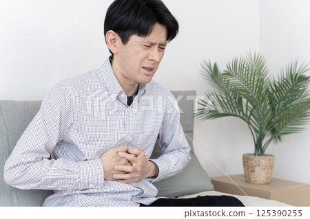 Man with stomach ache, stomach ache, gastroenteritis, diarrhea, constipation 125390255