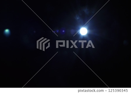 Sun flare on the black background 125390345
