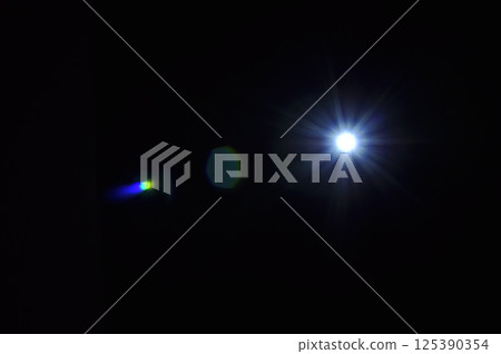 Sun flare on the black background 125390354