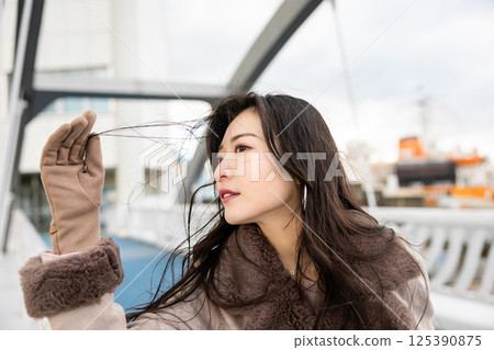 Beautiful woman thinking looking at the sky Beautiful woman thinking looking at the sky 125390875