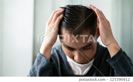 Man concerned about thinning hair (AI-generated image) 125390912