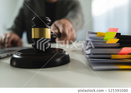 gavel and legal documents stacked books law in a library on legal documents 125391080