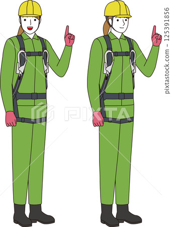 A construction worker wearing a fall prevention full harness and lanyard. A smiling woman 125391856
