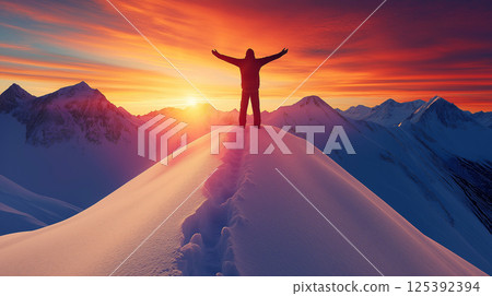 Hiker celebrating reaching snowy mountain peak at sunset Hiker celebrating reaching snowy mountain peak at sunset 125392394