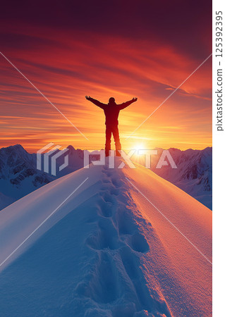 Hiker celebrating reaching snowy mountain peak at sunset Hiker celebrating reaching snowy mountain peak at sunset 125392395