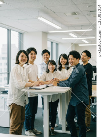 Japanese employees sharing ideas with diverse colleagues (AI generated image) Japanese employees sharing ideas with diverse colleagues (AI generated image) 125393014