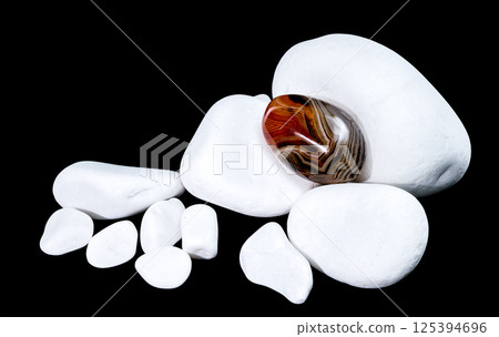 Polished Agate Stone Among White Pebbles 125394696