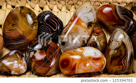 Assorted Polished Agate Stones in Woven Basket, Colorful Collection 125394701