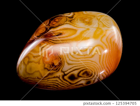 Polished Agate Specimen with Swirling Bands on Black Polished Agate Specimen with Swirling Bands on Black 125394705