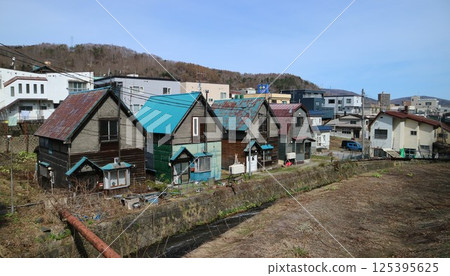 A retro Showa-era residential view from Otaru City's Midori Momiji Bridge A retro Showa-era residential view from Otaru City's Midori Momiji Bridge 125395625