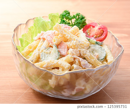 Macaroni salad served in a transparent bowl Macaroni salad served in a transparent bowl 125395731