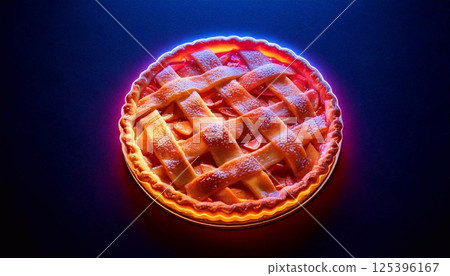 Brightly lit apple pie with a neon glow set against a dark background 125396167