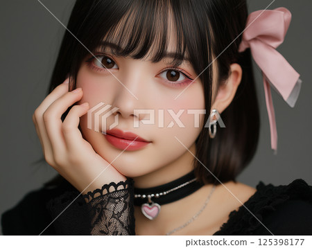 A close-up of a woman wearing subculture/landmine fashion and makeup 125398177