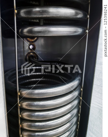 Close-up view of sleek coil system in modern appliance 125398241