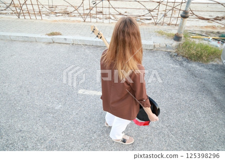 Girl Plays The Bass Instrument Music In The Street Girl Plays The Bass Instrument Music In The Street 125398296