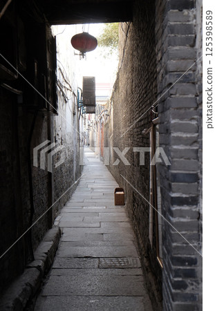 Old narrow street in Chinese water village Xitang. It is one of six destination ancient Town, located in Zhejiang Province, China 125398589