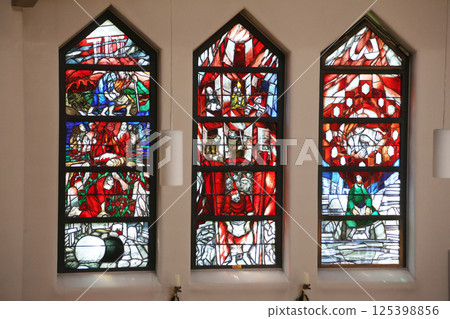 Stained glass window by Sieger Koder in St. John church in Piflas, Germany Stained glass window by Sieger Koder in St. John church in Piflas, Germany 125398856