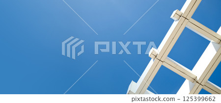 Symmetrical architecture roof minimalist grid pattern against deep blue sky with copy space background 125399662