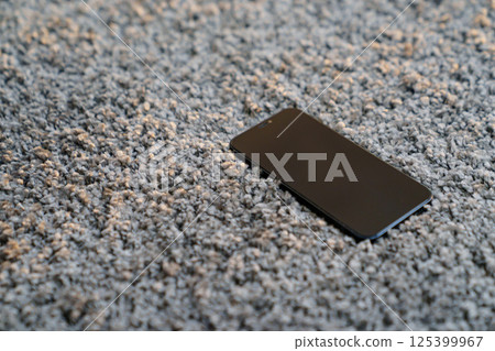 phone on the grey Interior pile carpet phone on the grey Interior pile carpet 125399967