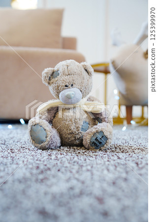 close-up. teddy bear on the grey Interior pile carpet made of polypropylene. close-up. teddy bear on the grey Interior pile carpet made of polypropylene. 125399970