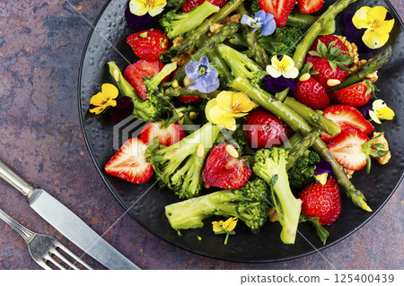 A refreshing asparagus salad with strawberries. A refreshing asparagus salad with strawberries. 125400439