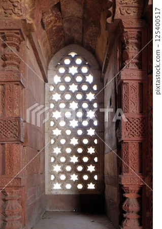 Window with sunglow in Alai Minar, Qutub Minar complex, Delhi, India 125400517