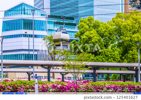 Yokohama cityscape in Japan. Fresh greenery in front of Sakuragicho Station... View of Yokohama City Hall and the ropeway. Towards a new era = April Yokohama cityscape in Japan. Fresh greenery in front of Sakuragicho Station... View of Yokohama City Hall and the ropeway. Towards a new era = April 125401627
